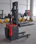 Heavy Duty Electric Pallet Stacker Forklift powered warehouse lift truck with black and red finish in a warehouse setting.