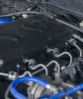 Silicone Vacuum Tubing Hose With Inner Diameters From One Eighth Inch To One Half Inch, 6.6 Ft Black High Temperature Engine Vacuum Hose For Air Liquid And Oil Lines, Durable One Eighth Inch Wall Thick Tubing installed in a car engine.