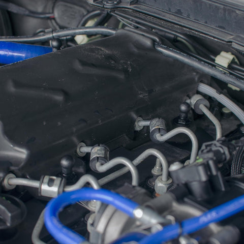 Silicone Vacuum Tubing Hose With Inner Diameters From One Eighth Inch To One Half Inch, 6.6 Ft Black High Temperature Engine Vacuum Hose For Air Liquid And Oil Lines, Durable One Eighth Inch Wall Thick Tubing installed in a car engine.