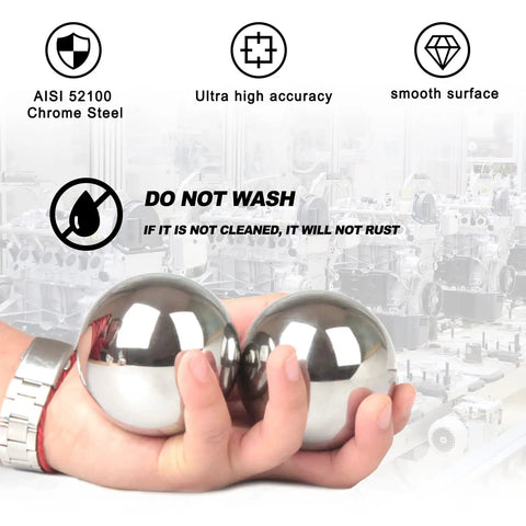 Hand holding 2 Pcs 2 and a Half Inch Steel Bearing Balls 63.5mm High Precision Alloy Balls For Industrial Bearings And Bike Wheel Hubs