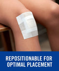 Nexcare strong pain-free medical tape on forearm; white fabric adhesive strip.