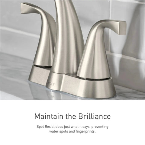 Spot Resist Brushed Nickel Two Handle Centerset Bathroom Sink Faucet With Drain Assembly, angled view on marble counter