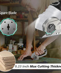 Super Lightweight Cordless Electric Scissors With 4V Battery And LED Light in use cutting cardboard with spare blade visible.