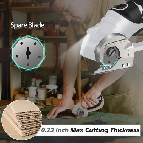 Super Lightweight Cordless Electric Scissors With 4V Battery And LED Light in use cutting cardboard with spare blade visible.