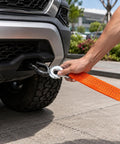 Heavy Duty Tow Strap With Hooks For Truck Car ATV Motorcycle Recovery 2 Inch By 40 Foot 20,000 Pound Break Strength Durable Recovery Strap For Safe Vehicle Tows attached to a truck bumper
