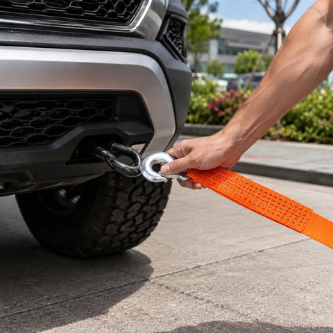 Heavy Duty Tow Strap With Hooks For Truck Car ATV Motorcycle Recovery 2 Inch By 40 Foot 20,000 Pound Break Strength Durable Recovery Strap For Safe Vehicle Tows attached to a truck bumper