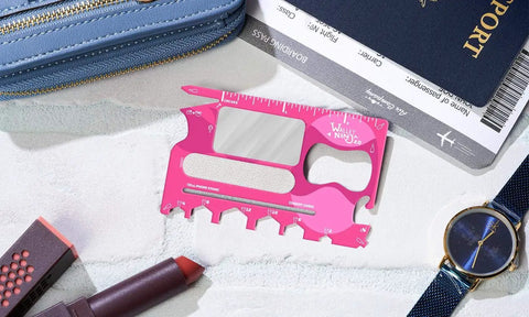 Dope 20-In-1 Multitool Card With Mirror And Nail File, Bottle Opener, Can Opener, Hex Nuts Size #2-#12, Pink on table