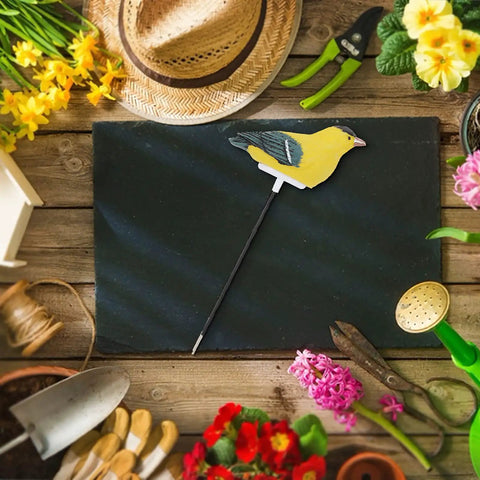 Bird Shaped Soil Moisture Sensor With Long Probe Hygrometer for Indoor and Outdoor Plants Garden Lawn Water Monitor Battery Included Yellow Indicator Light on gardening table.