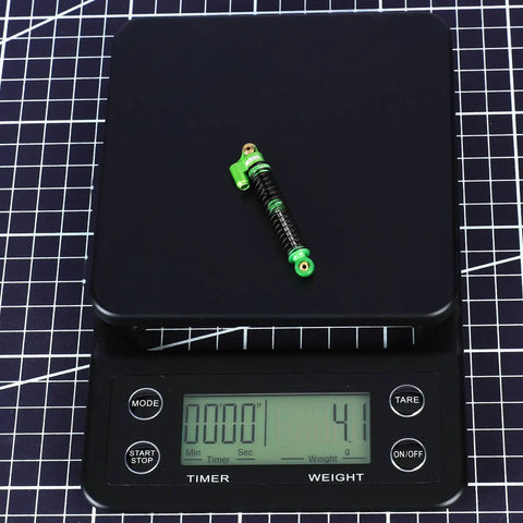 Beefed Up Aluminum Oil Filled RC Shocks for Axial AX24 XC1 4WS 1 24 Scale Upgrades on weighing scale
