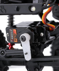 Close-up of Two Pack Emax ES08MAII 12g Analog RC Servo attached to RC crawler, showcasing metal gear and wires, part of upgrade parts.