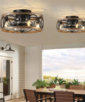 Outdoor patio setup with two Farmhouse Style Ceiling Fan With Lights Remote Control, Caged Flush Mount 18 Inch Reversible Bladeless Design