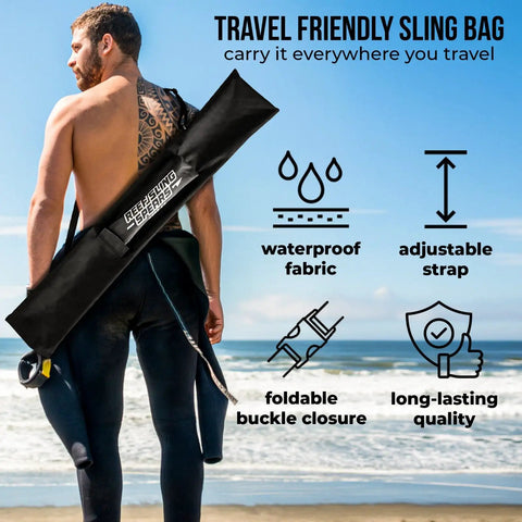 Diver with Travel Ready Fiberglass Pole Spear for Spearfishing, 72 Inch Harpoon, Travel Bag visible, on beach background