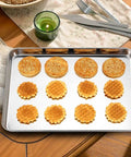 Three Piece Stainless Steel Baking Sheet Set Built Tough For Real Home Chefs Non Toxic And Easy Clean Heavy Duty Cookie Sheets shown with baked goods