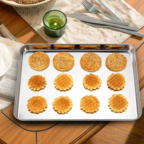 Three Piece Stainless Steel Baking Sheet Set Built Tough For Real Home Chefs Non Toxic And Easy Clean Heavy Duty Cookie Sheets shown with baked goods