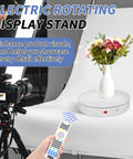 Foxvee Motorized Electric Turntable Remote Controlled Rotating Display Stand Speed Adjustable 360 Degree Photography Platform For 3d Scan Showcase And Multi Mode Video With White Finish with vase on a white backdrop.