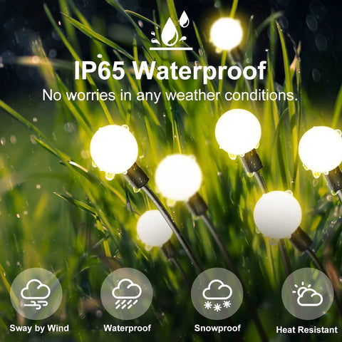 Solar Powered Firefly Lights 4 Pack With 8 LEDs Each shown in outdoor garden setting with waterproof feature, glowing in rain