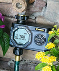 Hydrologic 4 Zone Digital Water Timer With Smart Zone Control, mounted on a water spigot among garden plants