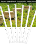 6 Pack Metal Beehive Frame Spacers For Solid Hive Framing Rugged Beekeeping Frame Strips in front of wooden hives