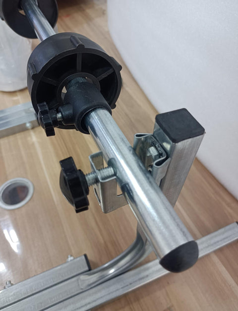 Close-up of Heavy Duty All Metal Roll Holder Dispenser For Bubble Wrap Stretch Film showing adjustment knobs and galvanized steel parts.