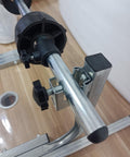 Close-up of Heavy Duty Metal Roll Dispenser For Bubble Wrap Stretch Film And Foam showing steel components and adjustment knobs.