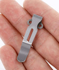 Industrial Strength Titanium Replacement Screws And Pivot Hardware Kit With A Deep Carry Pocket Clip For Folding Knife Upgrade, showing a titanium pocket clip in hand.