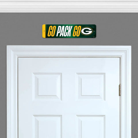 Premium Green Bay Packers Metal Street Sign Wall Art featuring bold graphics above a white door in a home interior.