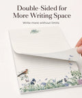 Hand flipping double-sided page from Cute 66-Piece Stationery Kit With Envelopes No-Bleed Lined Paper Floral Designs For Beautiful Handwritten Notes Totally Giftable For Women, Sweet Stationery Supplies And Personalized Gift For Loved Ones, showing floral border.