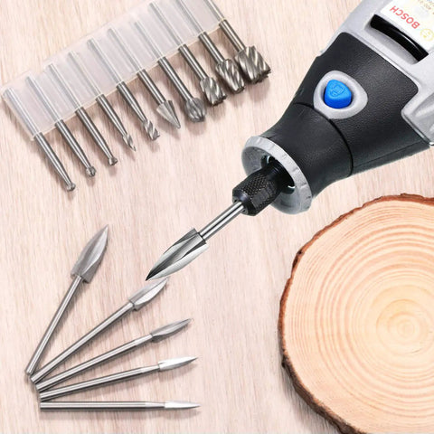 Wood Carving And Engraving Drill Bit Set 15 Piece Kit with engraving bits, HSS carbide rotary burrs, and rotary tool on wood surface.