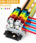 UK5N series terminal blocks with colorful wiring on a DIN rail, showing multiple color-coded channels for organized electrical connections.