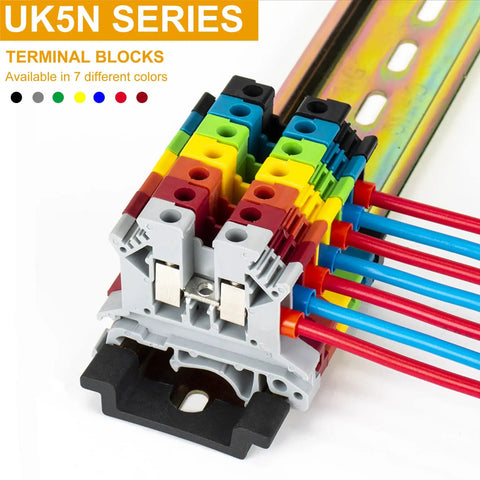 UK5N series terminal blocks with colorful wiring on a DIN rail, showing multiple color-coded channels for organized electrical connections.