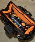Top view of Tradesman Pro Wide Open Tool Bag with 1680 Ballistic Weave, molded bottom, bright orange interior, tools inside