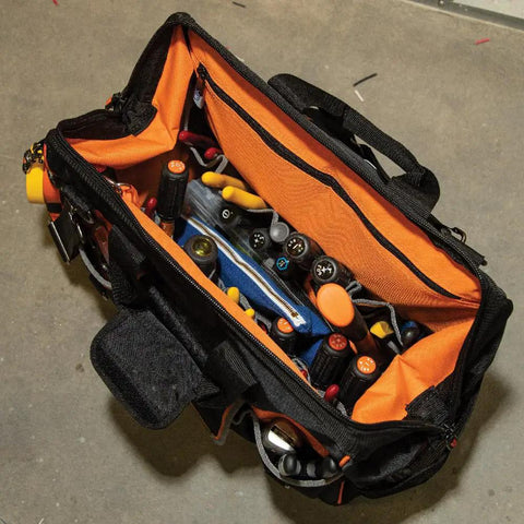 Top view of Tradesman Pro Wide Open Tool Bag with 1680 Ballistic Weave, molded bottom, bright orange interior, tools inside