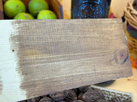 Wooden plank showing Black Walnut Wood Stain 1 Pint Water Based Non Toxic Low Odor Rich Dark Tone applied on surface.
