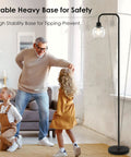Cool Industrial Glass Globe LED Floor Lamp 63 Inch Tall Black Standing Reading Light in cozy living room scene