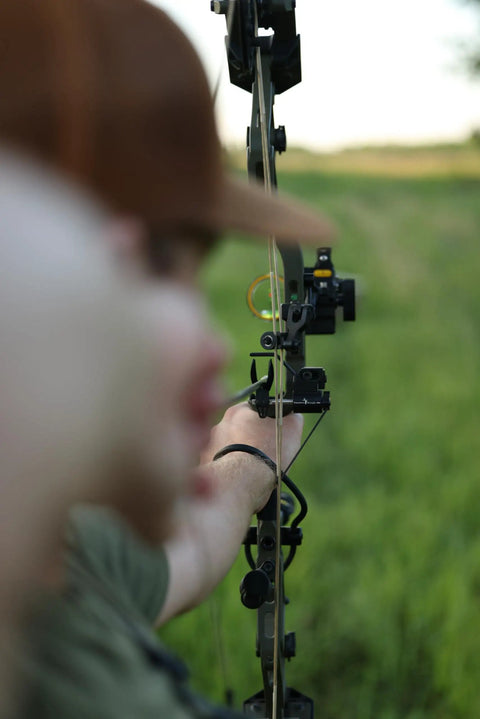 Person aiming with a bow using Sync Drop Away Archery Arrow Rest With Smooth Cable Driven Draw For Consistent Shot Laterally Adjustable Launcher Arms Easy Windage And Elevation Adjustments Right Hand Black Today
