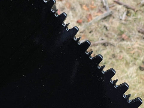 Close-up of serrated edge on Beefy Mini Wrecker Stump Bucket for Small Tractors Heavy Duty Tractor Attachment for yard clearing.