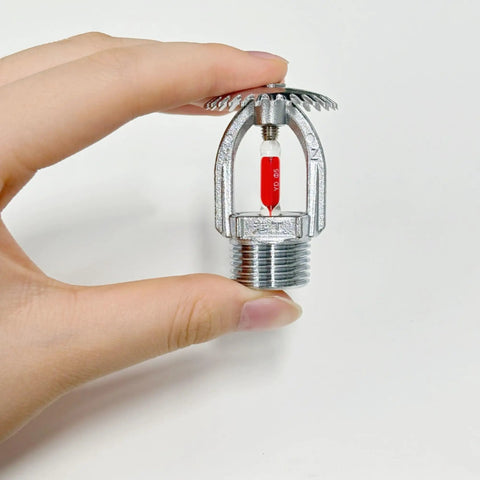 Heavy Duty Upright Fire Sprinkler Head With 68 Celsius Red Glass Bulb And Durable Copper Alloy Frame Finished In Polished Chrome held in hand.
