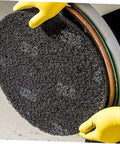Close-up of Five Pack 17 Inch Black Microfiber Floor Cleaning Pads for Polishing Scrubbing and Wax Removal being installed