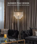 Living room with Three Layer K5 Crystal Floor Lamp with Sparkling Triper Layer Shade, modern chrome finish, elegant glow.