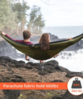 All In One Camping Hammock With Mosquito Net And Rain Fly Tarp Portable Nylon Parachute Hammock Set in use by two people outdoors
