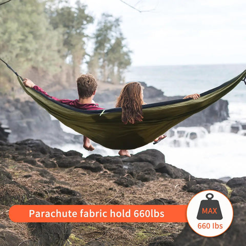 All In One Camping Hammock With Mosquito Net And Rain Fly Tarp Portable Nylon Parachute Hammock Set in use by two people outdoors