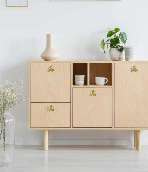 Six Piece Gold Cabinet Knobs Set With Flower Shape Zinc Alloy Vintage Pulls on modern wooden cabinet with decorative items