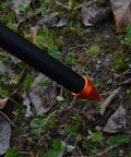 Close-up of the camping tripod leg with non-slip foot on the Campfire Tripod Grill Stand With Adjustable Height Ultra Portable Aluminum Cooking Gear For Camping Fits Pots And Pans Folding Design Stable On Any Terrain Easy To Carry And Store.