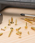 Go-To Brass Wood Screws 100 Pack M2x6mm Phillips Flat Head Self-Tapping Fasteners for woodworking projects on table