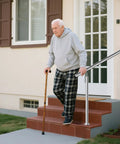 Rock Solid Stainless Steel Handrail For Outdoor Steps Featuring Adjustable Angles And Heavy Duty Build delivering support for a man on stairs.
