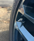 Premium Chrome Spike Aluminum Tire Valve Stem Caps Set Of 4 Universal Fit For Cars Bikes Trucks RVs Motorcycles Trailers visible on wheel