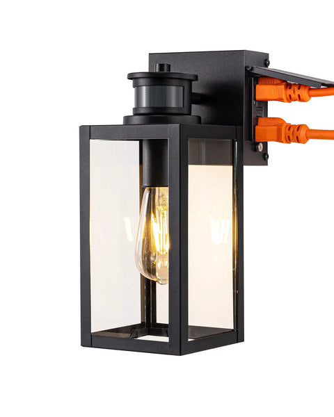 Built Tough Black Motion Sensor Outdoor Wall Light With Dusk Till Dawn Auto Sense And Built In Two Electrical Outlets For Plugging Yard Gear Weatherproof Plug Ready Lighting with E26 socket and GFCI protection.