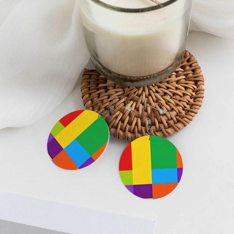 Chic Colorful Grid Print Dangle Earrings For Women Totally Lightweight Silver Plated Ear Hooks Hella Safe For Sensitive Ears displayed beside a candle.