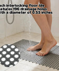 Person standing on 50 Pack Interlocking Drainage Mats 11.8 By 11.8 Inches Non Slip TPE Floor Tiles With Drain Holes