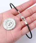Hand holding bracelet with 3MM ID cord end cap and lobster clasp from 20 sets stainless steel necklace clasps and end caps for jewelry making.